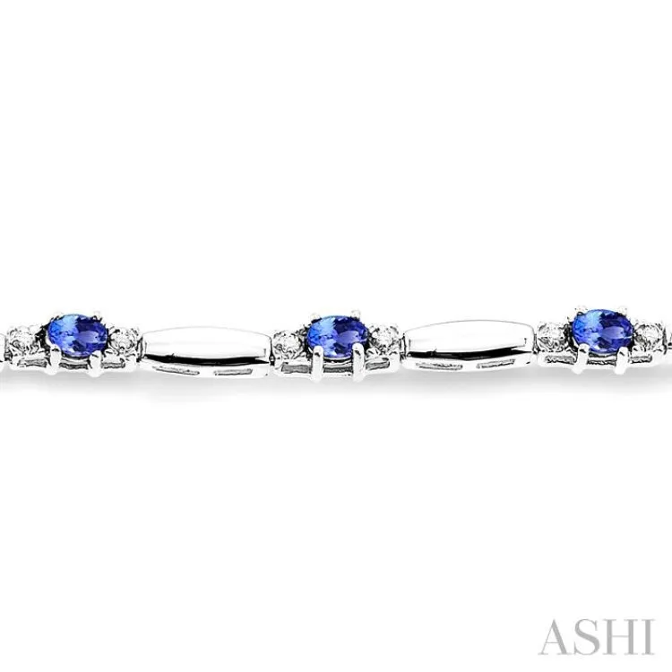 1/10 Ctw Bar and Oval Mount Round Cut Diamond & 5x3MM Oval Cut Tanzanite Precious Bracelet in 10K White Gold