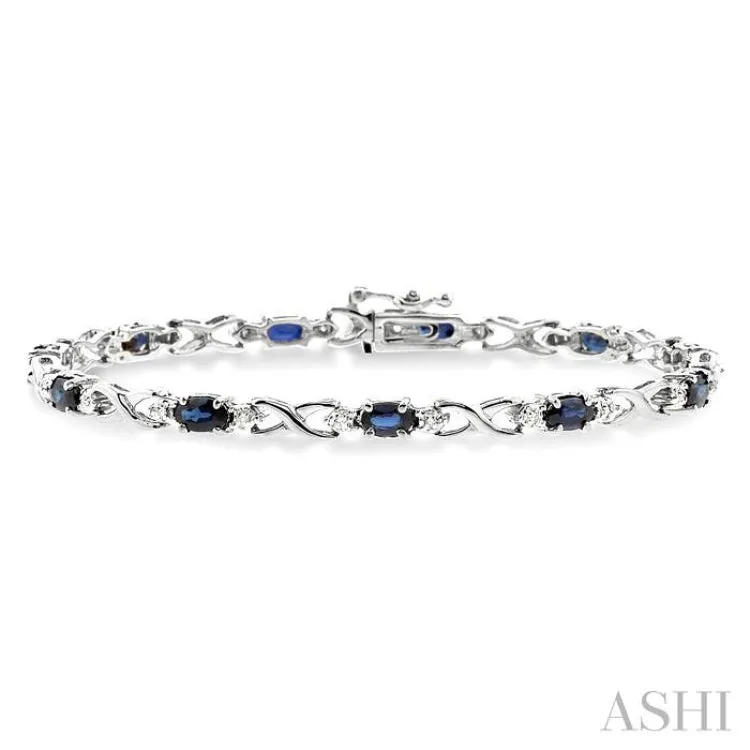 5x3 MM Oval Cut Sapphire and 1/10 Ctw Single Cut Diamond Bracelet in 10K White Gold