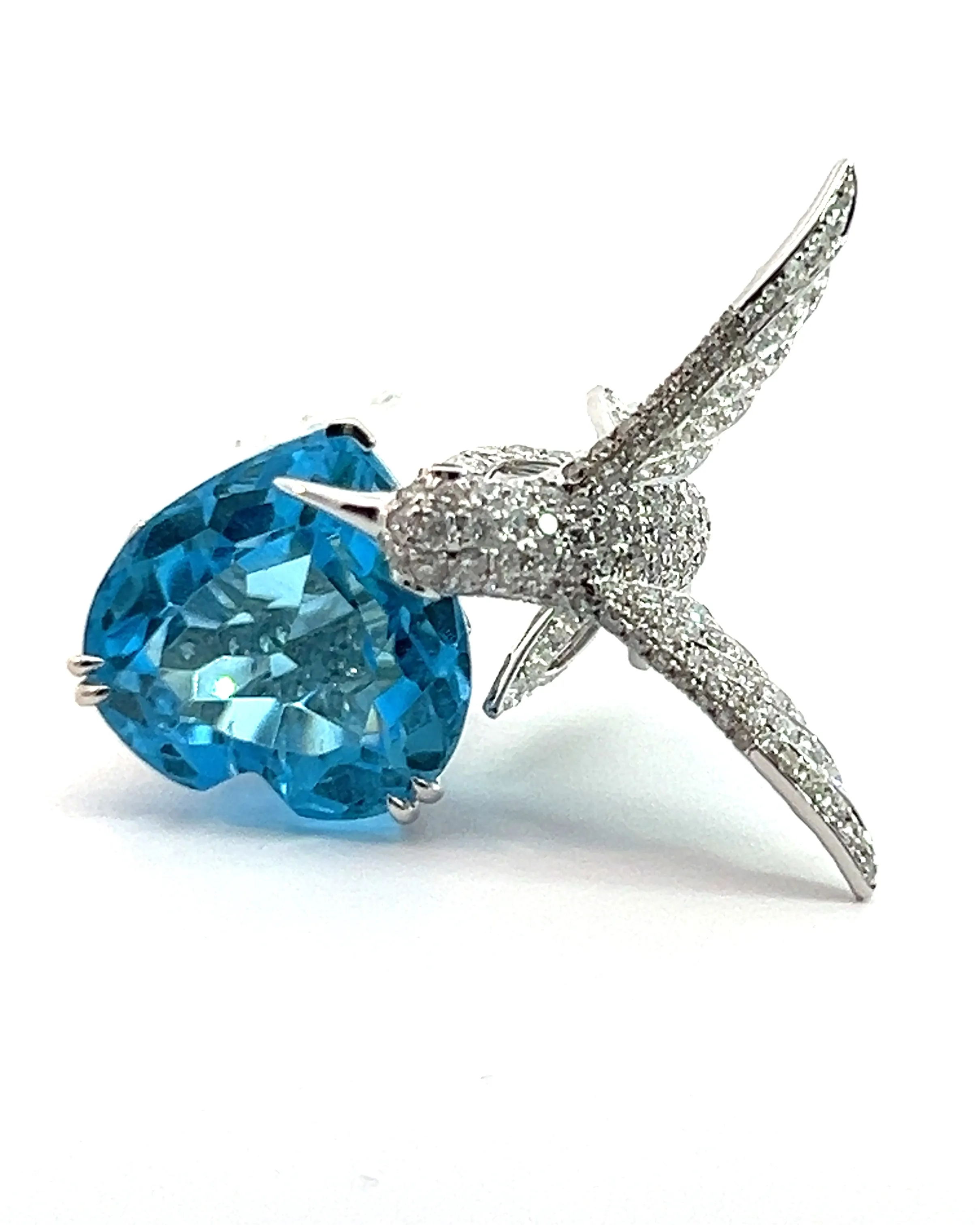 Blue Topaz and diamond humming bird ring