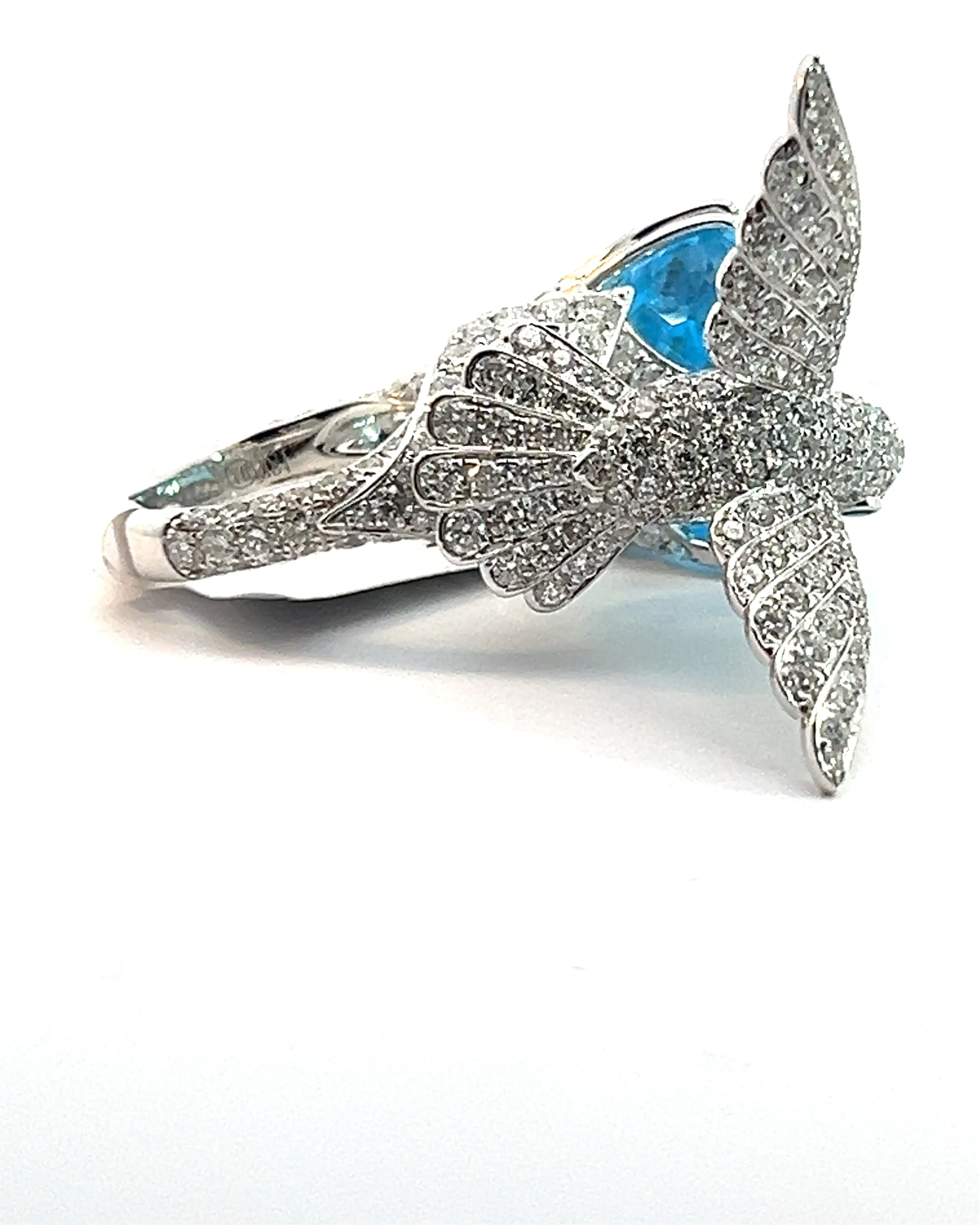 Blue Topaz and diamond humming bird ring