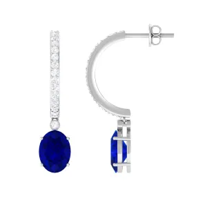 Oval Created Blue Sapphire Silver Hoop Drop Earrings with Moissanite