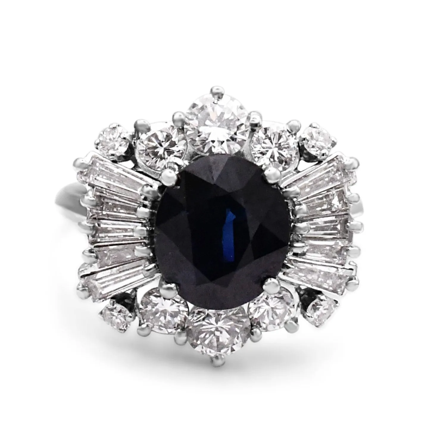 Oval Sapphire And Brilliant & Baguette Diamond Cluster Ring