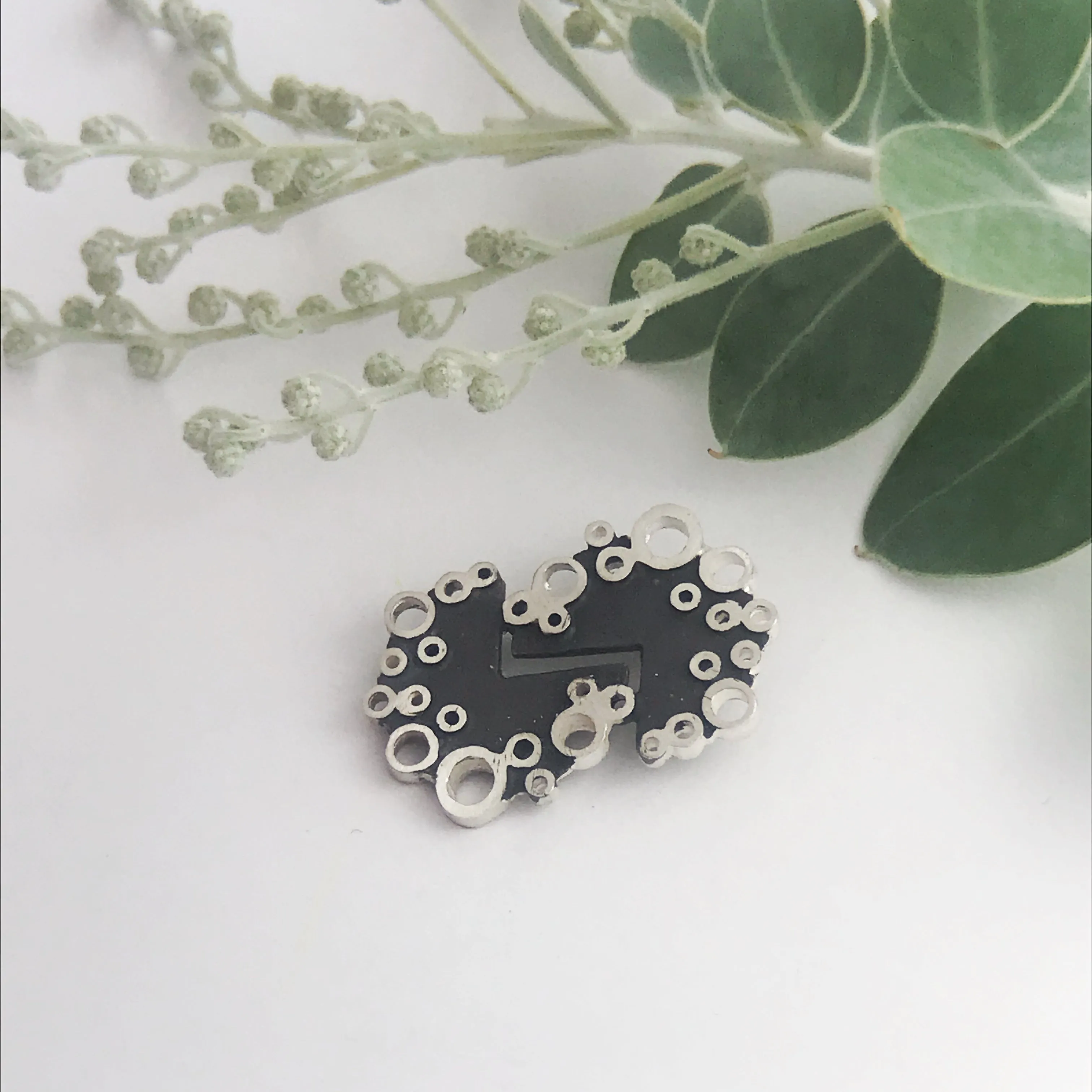 Silver spot Brooch